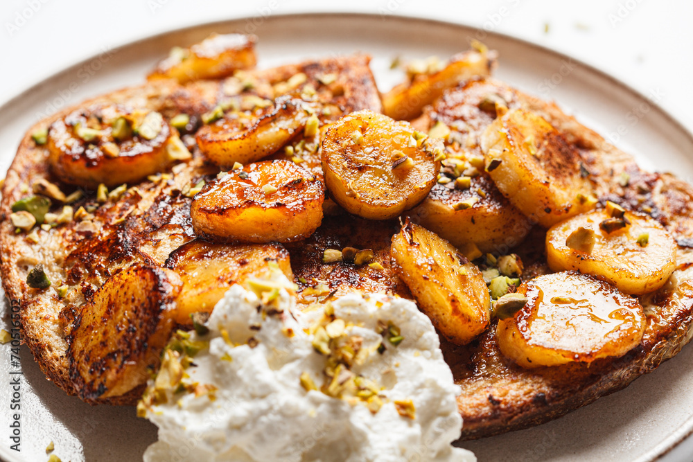 French toast with caramelized banana and pistachios. French toast with caramelized banana and pistachios.