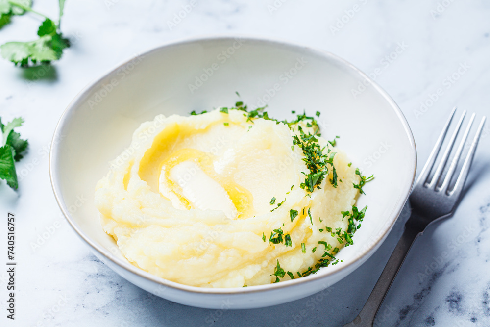 Classic mashed potatoes with butter and herbs.