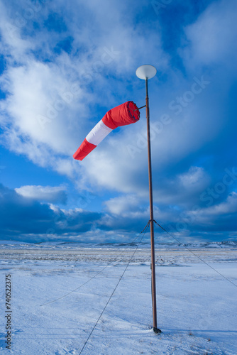 Windsock against beautiful blue sky with nice clouds