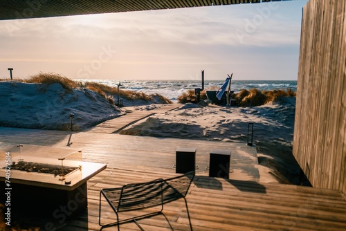 House on the shore of the Baltic Sea. Terrace at sunset