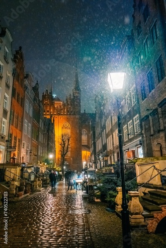 evening street in the old town in Gdansk Poland, snowstorm