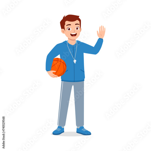 happy young physical education teacher holding ball
