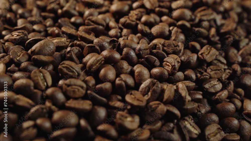 lots of coffee beans The camera slowly pans past. There was sunlight shining from behind. lots of coffee beans The camera slowly pans past. There was sunlight shining from behind.