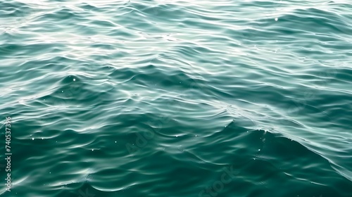 Blue green surface of the ocean in Catalina Island California with gentle ripples on the surface and light refracting