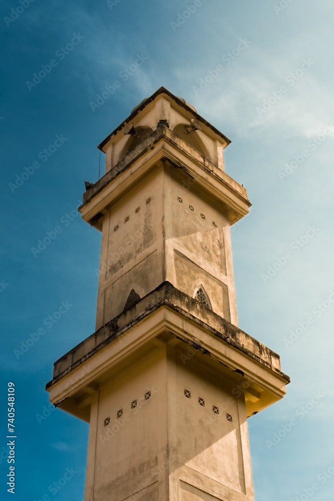 A picture of mosque tower with blue beautiful background A picture of mosque tower with blue beautiful background