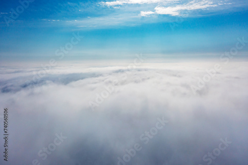 Aerial view of the city in the fog. Skyscrapers above the fog