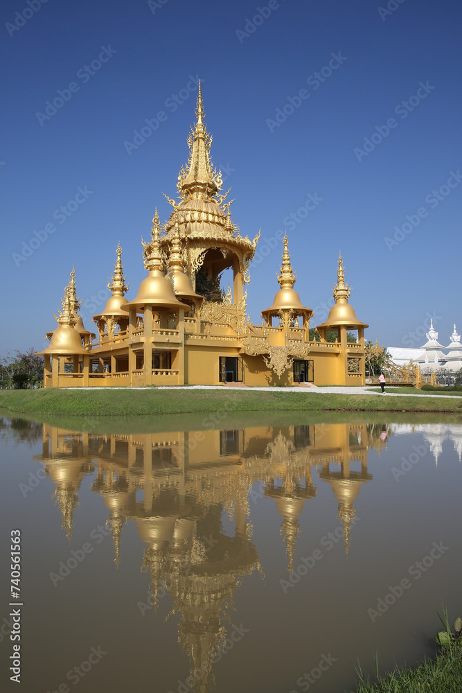 Wat Rong Khun (White Temple) in Chiang Rai city, Thailand. Religious traditional national Thai architecture. Landmark, view, sight, attraction, architectural monument of Chiang Rai town, Thailand