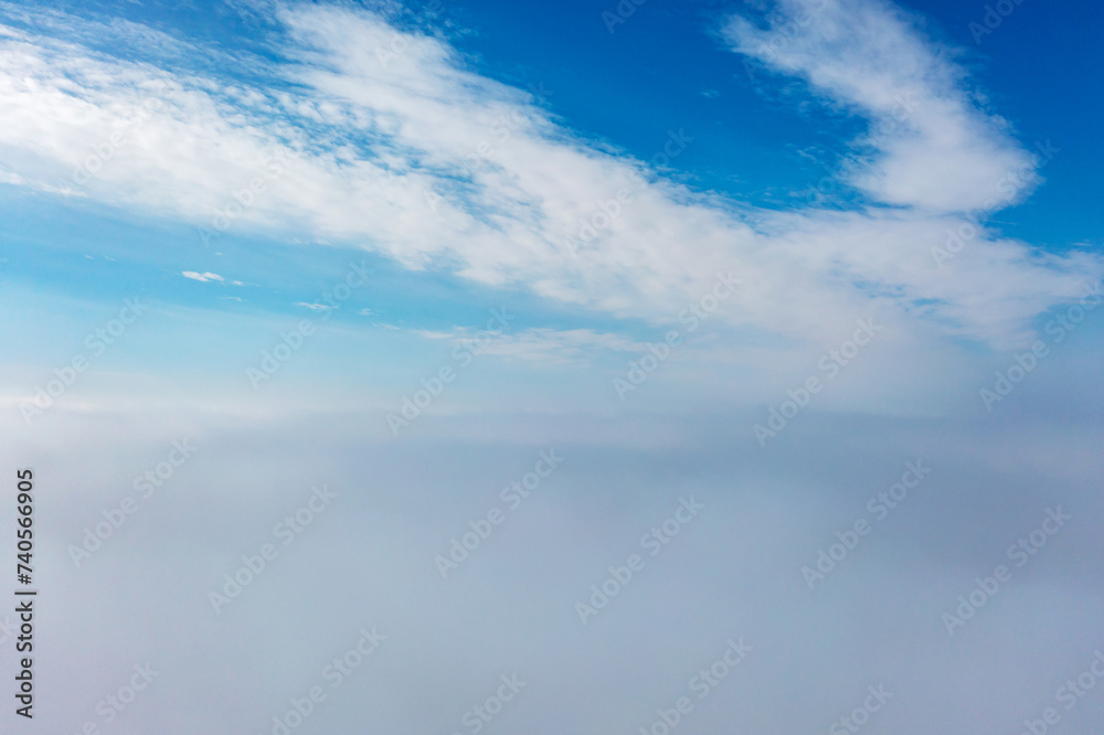 Aerial view of the city in the fog. Skyscrapers above the fog Aerial view of the city in the fog. Skyscrapers above the fog