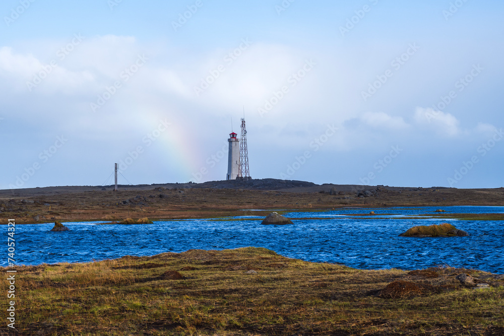 Stokksnes Lighthouse on iceland with a rainbow in summer Stokksnes Lighthouse on iceland with a rainbow in summer