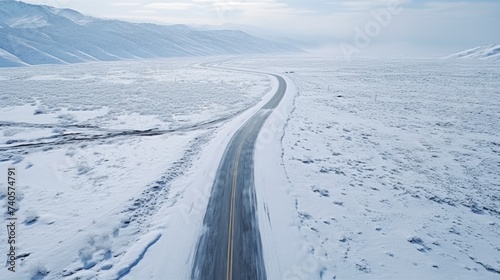 A car driving down a snow-covered road, suitable for winter driving concepts © Fotograf