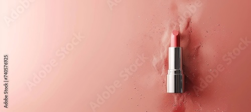 Assorted lipstick shades with smudged stains on pink background, ideal for text placement.