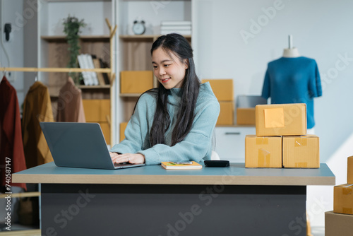 Woman start up small business owner at workplace. small business entrepreneur SME or freelance asian woman working with box at home...