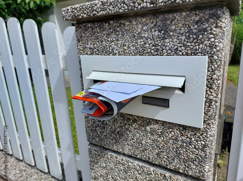 Obraz na płótnie white mailbox with letters and advertise on fence w salonie