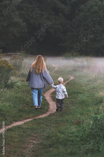 mother and child walking in the park © Wojciech Zieliński 