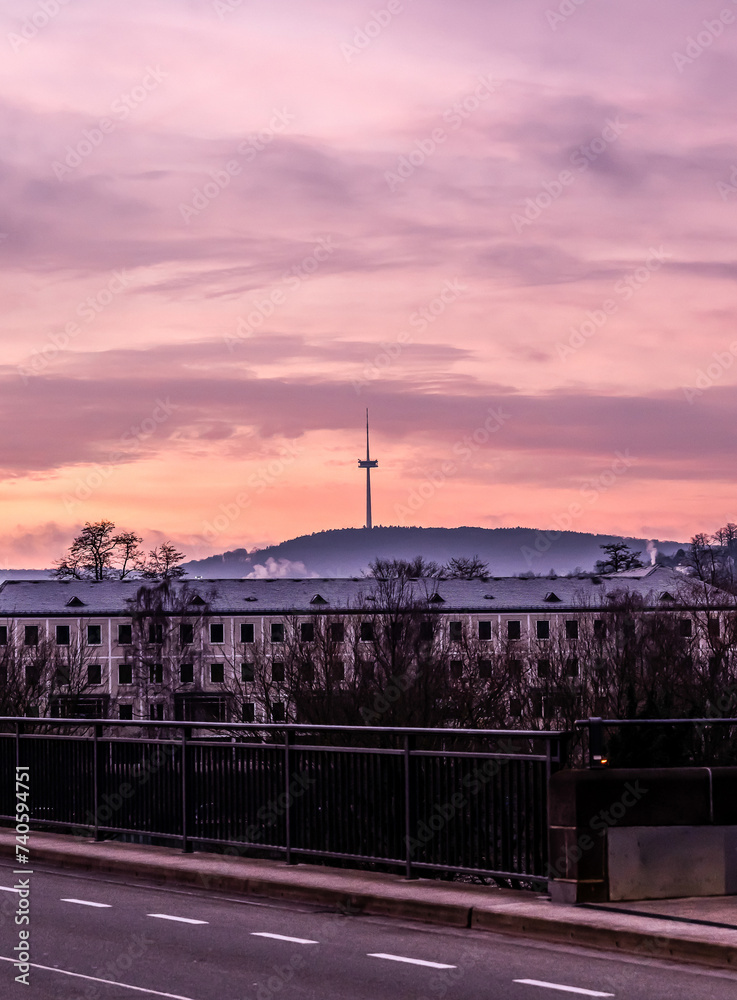 Colorful Sunset over huge transmitter tower above German town Koblenz and the Middle Rhine valley