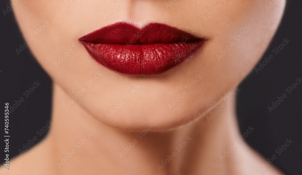 Closeup, woman and red lipstick for beauty and cosmetics, skin and glow with bold color on black background. Cosmetology, mouth and makeup with face, cropped and luxury with glamour in studio Closeup, woman and red lipstick for beauty and cosmetics, skin and glow with bold color on black background. Cosmetology, mouth and makeup with face, cropped and luxury with glamour in studio
