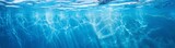 Underwater panorama of swimming pool water with sun reflections, panoramic banner background