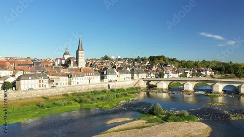 The Charite sur Loire bridge and a dune over the Loire in Europe, France, Burgundy, Nievre, in summer, on a sunny day. photo