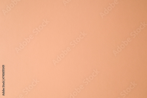 Empty blank peach fuzz pastel colored paper texture background.