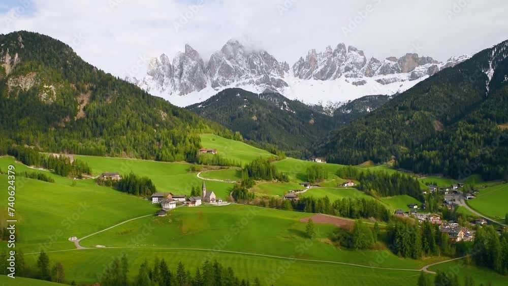 Spring landscape of Dolomites Alps. Famous Santa Magdalena village with church and beautiful Dolomiti mountains, Val Di Funes, Dolomites, Italy Spring landscape of Dolomites Alps. Famous Santa Magdalena village with church and beautiful Dolomiti mountains, Val Di Funes, Dolomites, Italy