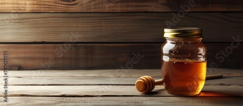 A delectable jar of golden honey displayed on a rustic wooden table