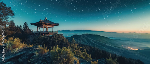 Mountaintop Zen Garden with Panoramic View Under Star-Filled Sky © Pongsapak