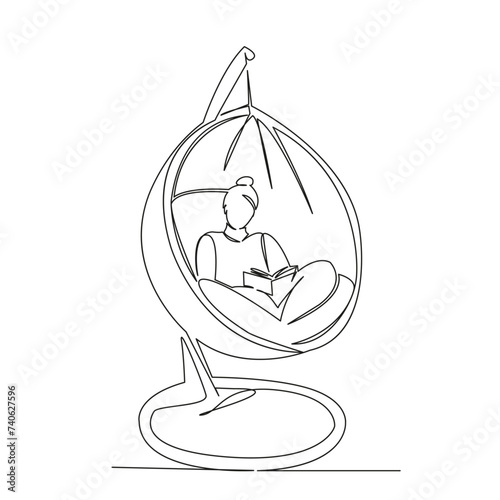 woman reading a book in a hammock chair