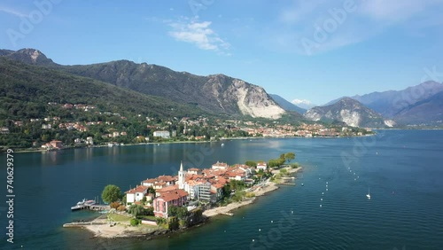 The island Isola della Malghera at the foot of the mountains on Lake Maggiore in Europe, Italy, Lombardy and Piedmont in the summer on a sunny day. photo