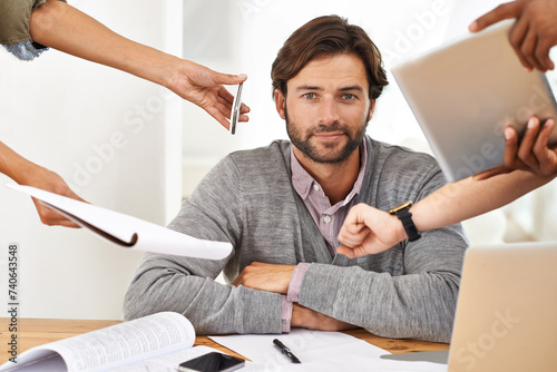 Busy, businessman and portrait with tasks in hands at office with schedule, agenda or overwhelmed by responsibility. Calm, manager and cope with stress at work with help of people to multitask photo