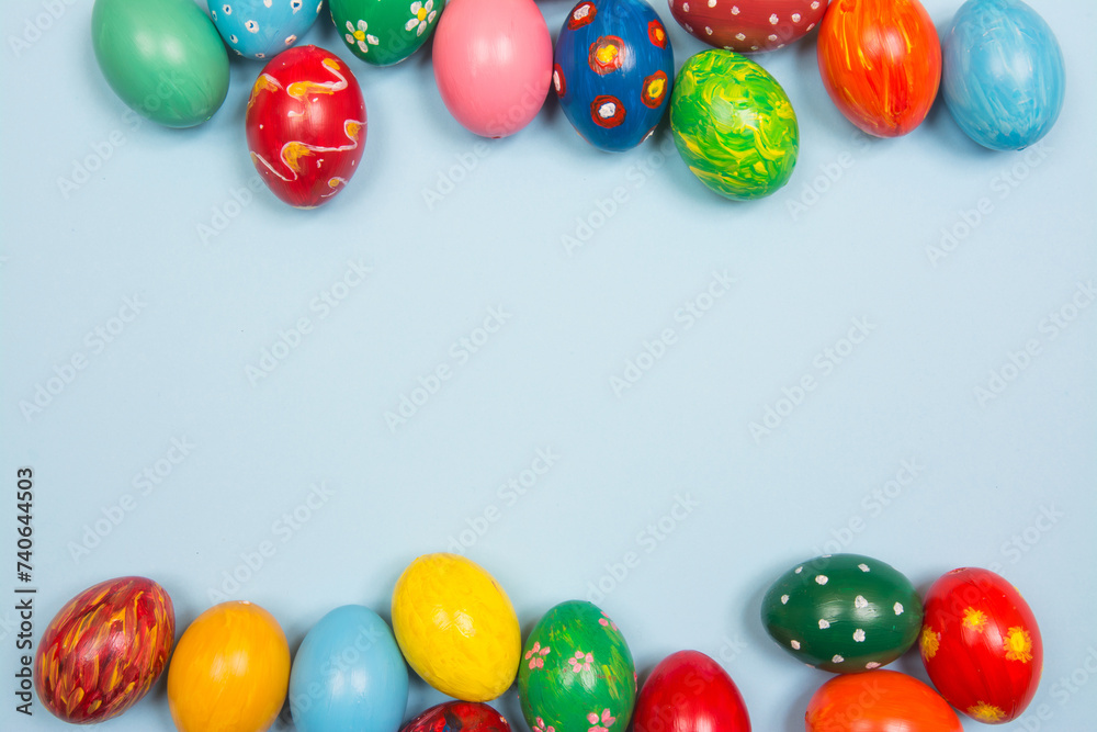 Colorful easter eggs on pastel blue background Colorful easter eggs on pastel blue background