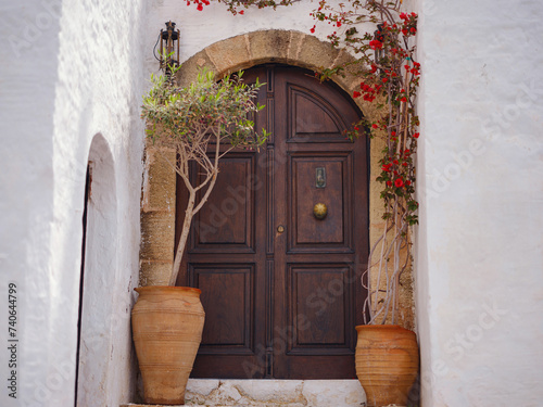 travel to city of Lindos on island of Rhodes, Greece. Details of streets of old town Lindos. Interesting elements of door, shutters, bas-relief of walls. tourist attraction on island of Rhodes