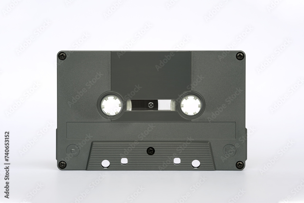 Obraz premium Front view of audio cassette standing isolated on white background