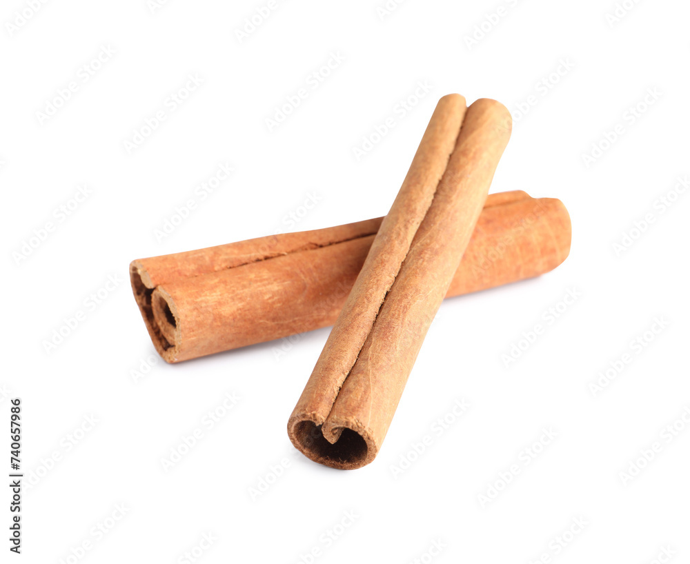 Two aromatic cinnamon sticks isolated on white Two aromatic cinnamon sticks isolated on white