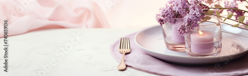 Elegant Table Setting with Lilac Blossoms and Candle