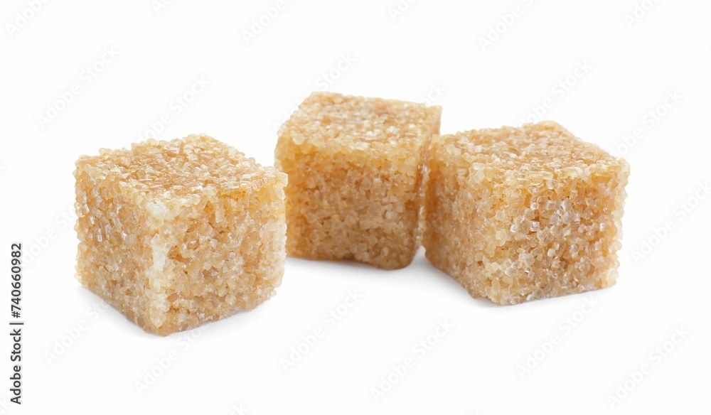 Three brown sugar cubes isolated on white Three brown sugar cubes isolated on white