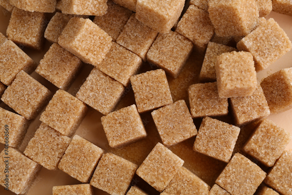 Brown sugar cubes on color background, top view Brown sugar cubes on color background, top view