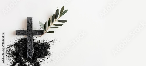 Cross, ashes, and olive leaves on white background. Ash Wednesday concept, easter, horizontal background, copy space for text