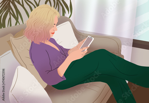 Woman relaxing on couch with smartphone photo