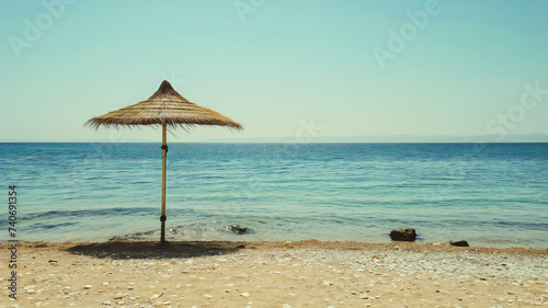 Tropical beach with umbrella, empty beach without people