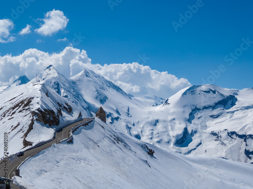 Grossglockner high alpine road going along majestic snow covered mountain peaks in High Tauern National Park, Carinthia Salzburg, Austria. Remote high altitude landscape in Austrian Alps. Nature lover