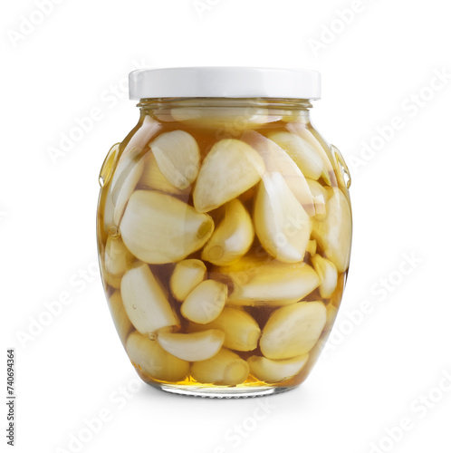 Garlic with honey in glass jar isolated on white
