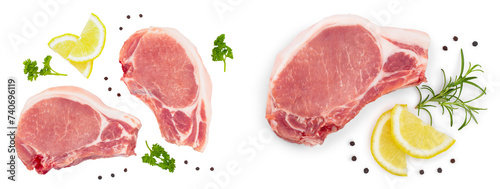 sliced raw pork meat with parsley and lemon isolated on white background. Top view. Flat lay © kolesnikovserg