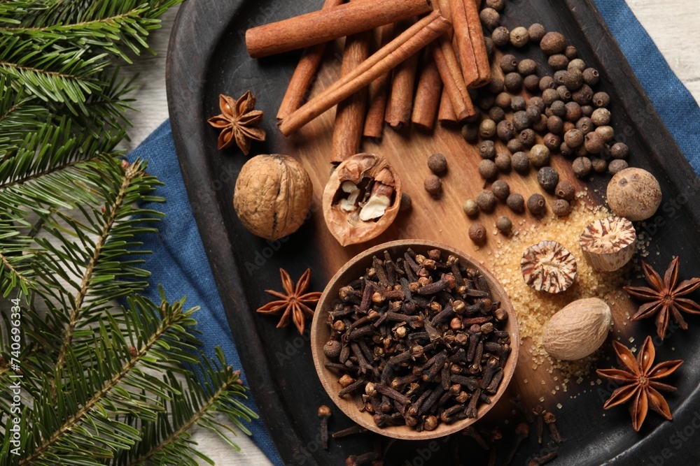 Different spices and nuts on table, flat lay Different spices and nuts on table, flat lay