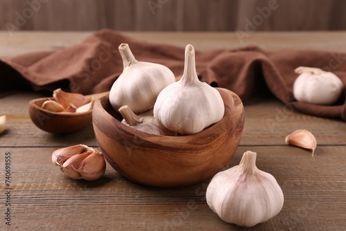 Fresh garlic on wooden table, closeup view