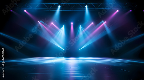 The stage background is illuminated by the light of a spotlight