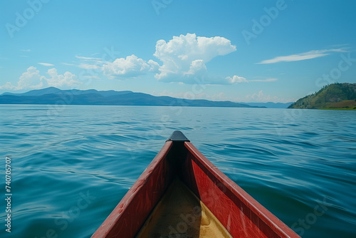POV riding a canoe on a lake on a sunny day