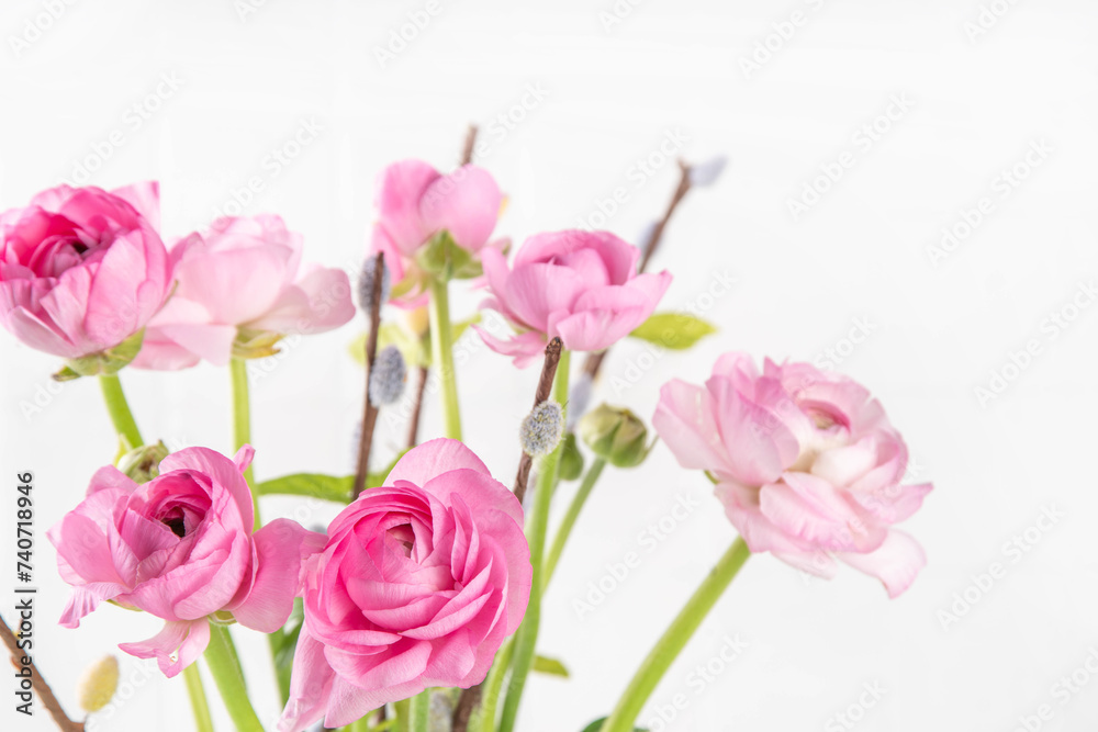 Fototapeta premium Ranunculus, willow, mimosa and gypsophila spring flowers bouquet