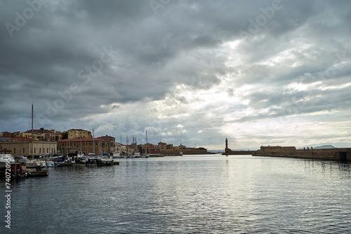 sailboats, historic buildings and tourists in the port of Chania on the island of Crete © GKor