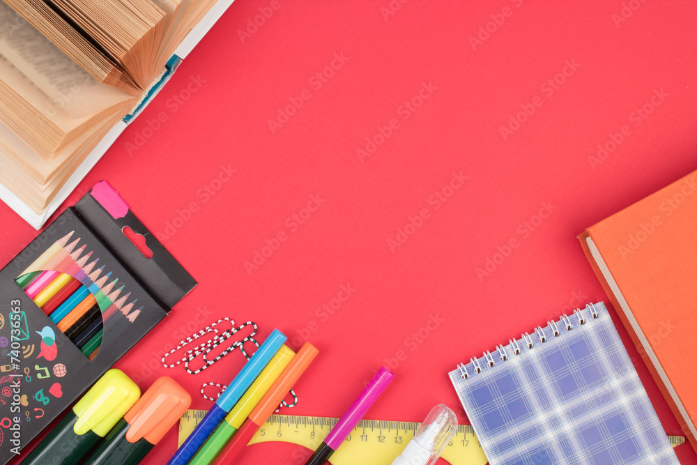 Back to school. Stationery on a red table. Office desk with copy space. Flat lay. Back to school. Stationery on a red table. Office desk with copy space. Flat lay.