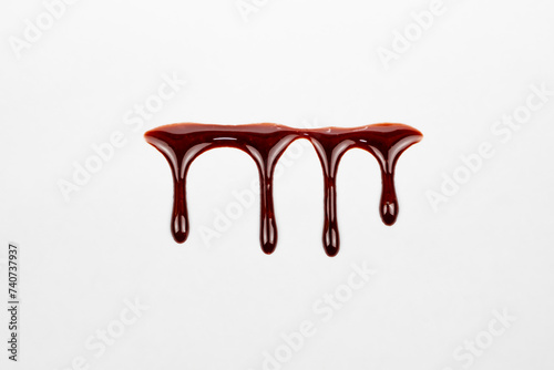 A blood spatter. A blood flowing down. Bloody pattern. Concepts of blood can be used in design